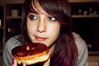 People & Humanity: girl eating doughnut