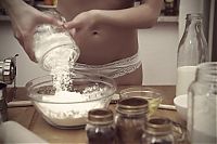 People & Humanity: young girl making cookies in the kitchen