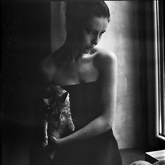 photo of girl with cat