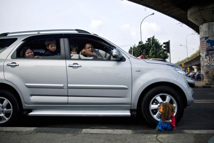 Monkey performs on the street, Indonesia