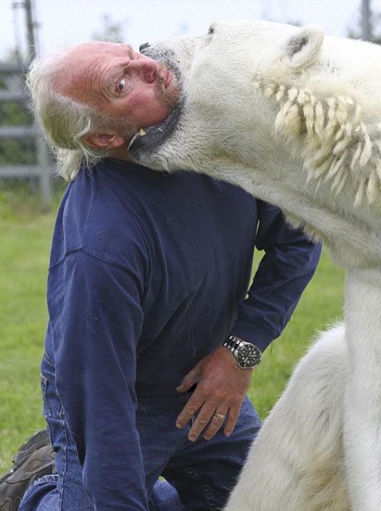 man with a polar bear