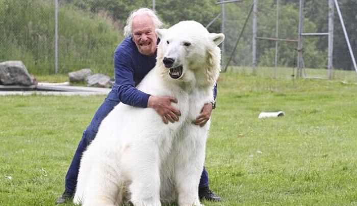man with a polar bear