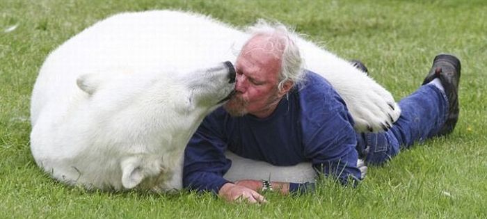 man with a polar bear