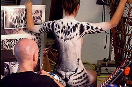 Body art girl with a leopard painting by Craig Tracy