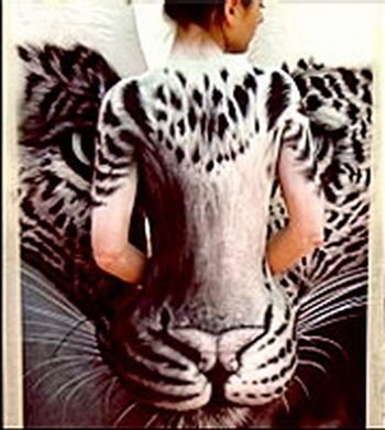 Body art girl with a leopard painting by Craig Tracy