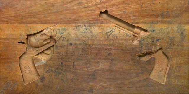 school desk table gun art