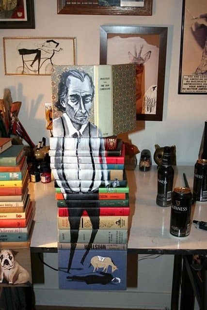 artwork on spines of stacked books