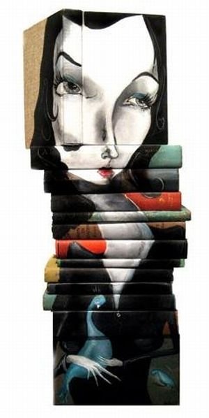 artwork on spines of stacked books