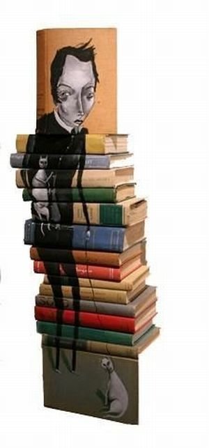 artwork on spines of stacked books