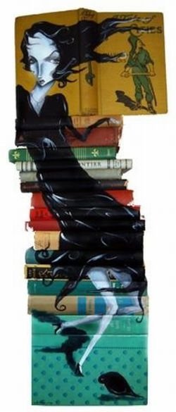 artwork on spines of stacked books