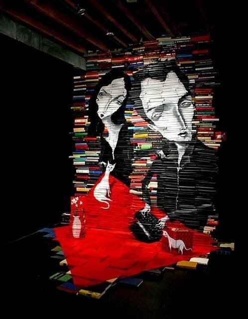 artwork on spines of stacked books