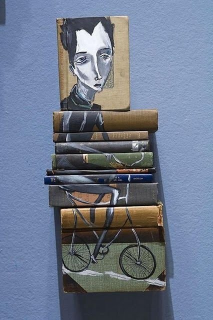 artwork on spines of stacked books