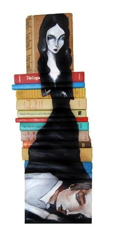 artwork on spines of stacked books
