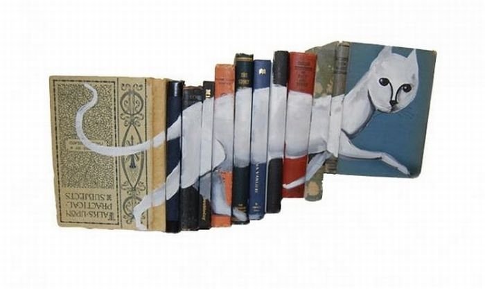 artwork on spines of stacked books