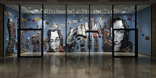 artwork on spines of stacked books