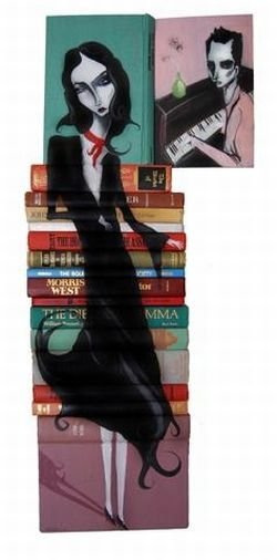 artwork on spines of stacked books