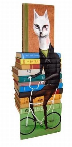 artwork on spines of stacked books