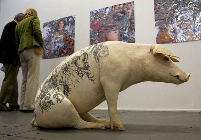 Tattooing pigs by Wim Delvoye