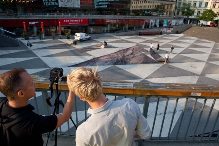 Mind your step illusion by Erik Johansson, Sergel's Square, Stockholm, Sweden