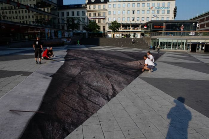 Mind your step illusion by Erik Johansson, Sergel's Square, Stockholm, Sweden