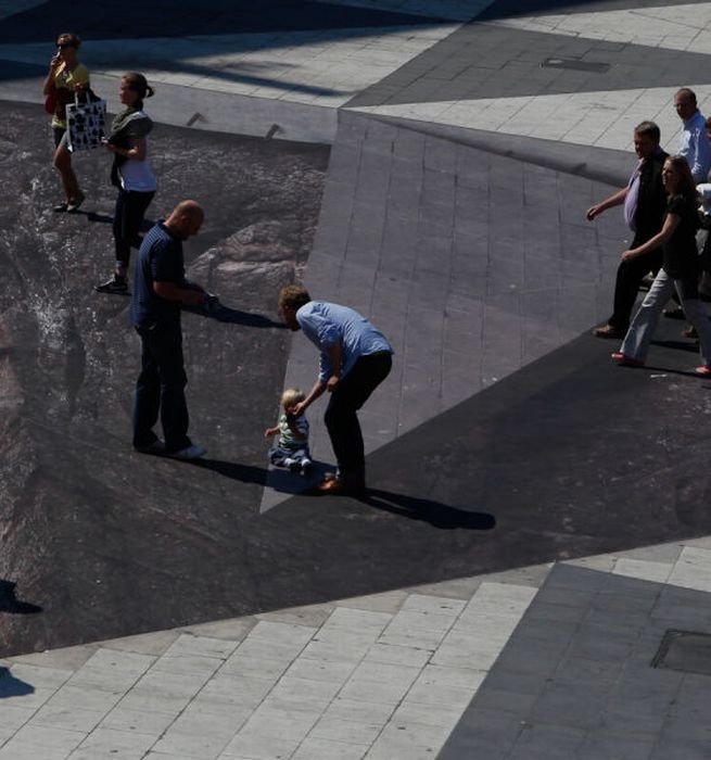 Mind your step illusion by Erik Johansson, Sergel's Square, Stockholm, Sweden