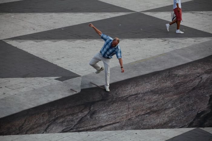 Mind your step illusion by Erik Johansson, Sergel's Square, Stockholm, Sweden