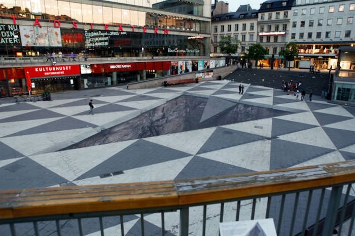 Mind your step illusion by Erik Johansson, Sergel's Square, Stockholm, Sweden