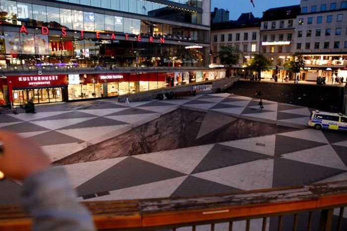 Mind your step illusion by Erik Johansson, Sergel's Square, Stockholm, Sweden