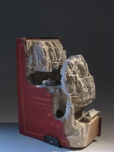 Book carvings projects by Guy Laramée