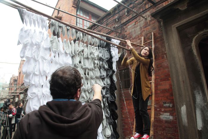 portrait made of socks, bamboo sticks and pins