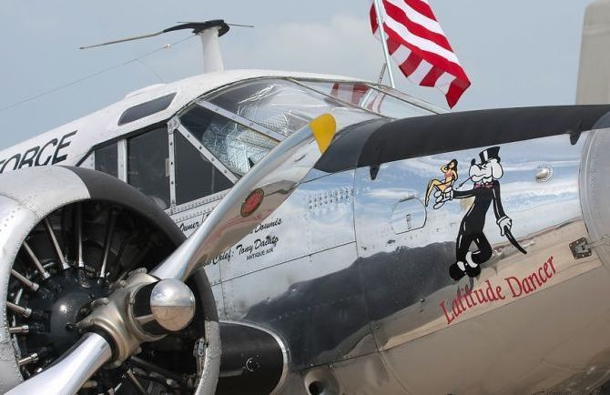 nose art painting of a military aircraft