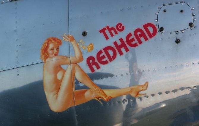 nose art painting of a military aircraft