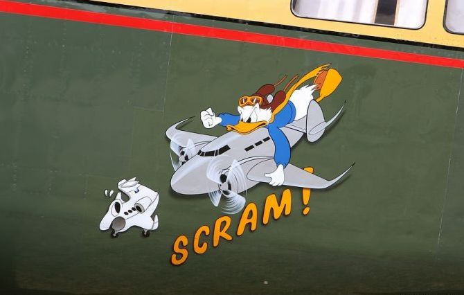 nose art painting of a military aircraft