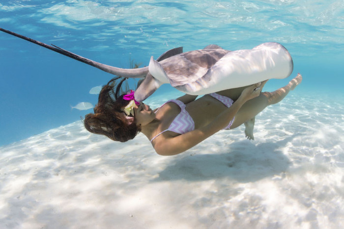 Mermaid and the stingray underwater photography by Christian Coulombe