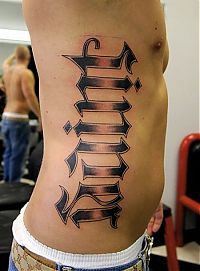 TopRq.com search results: typographic tattoos
