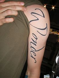 TopRq.com search results: typographic tattoos