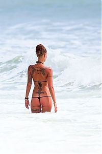 Art & Creativity: tattoo girl on the beach in the sea