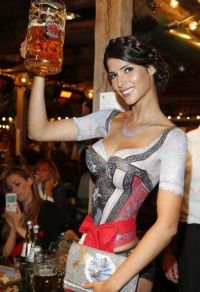 Art & Creativity: body art girl with a dirndl oktoberfest dress