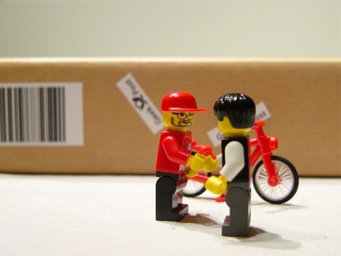 unpacking ipad with lego people