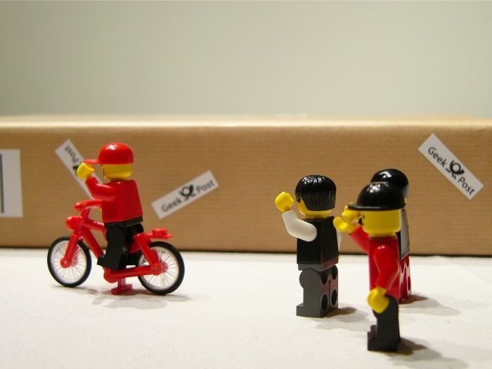 unpacking ipad with lego people