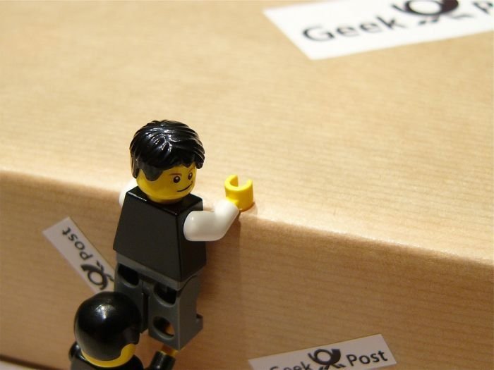 unpacking ipad with lego people