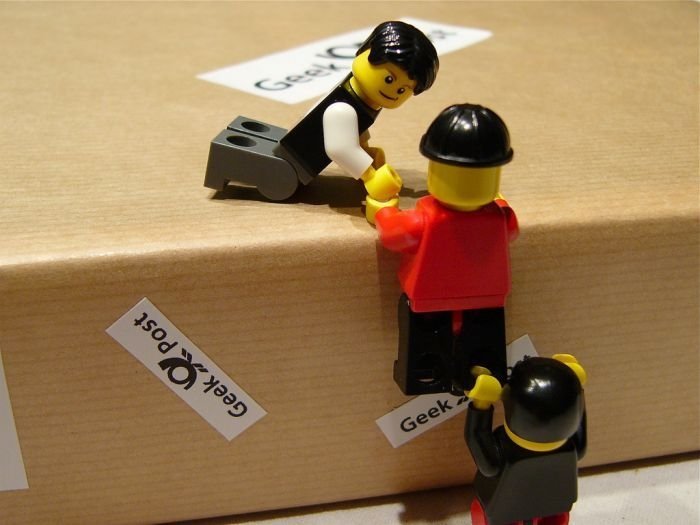 unpacking ipad with lego people