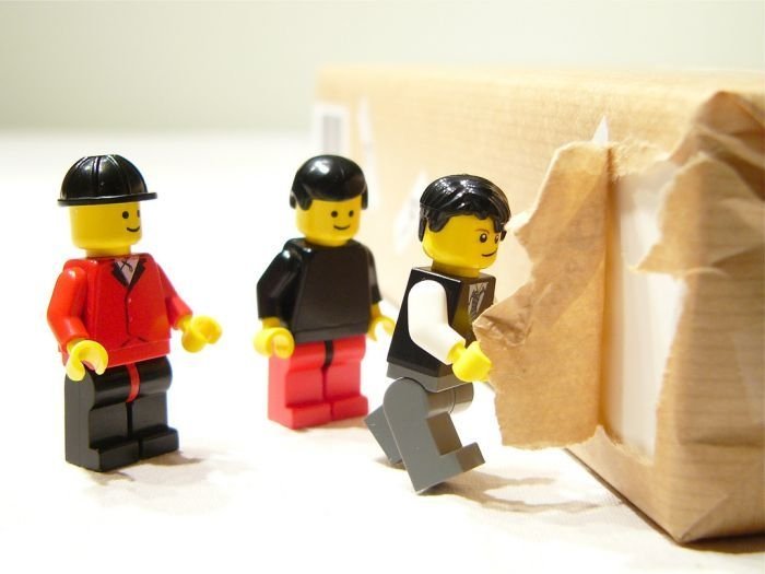 unpacking ipad with lego people