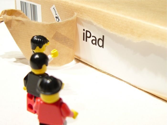 unpacking ipad with lego people