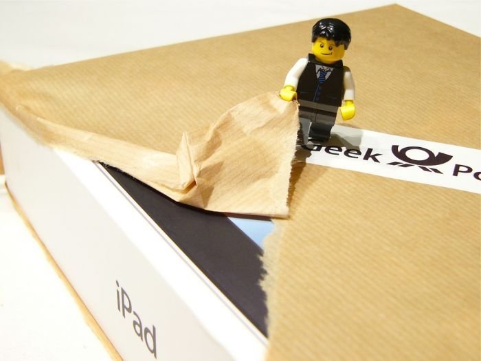 unpacking ipad with lego people