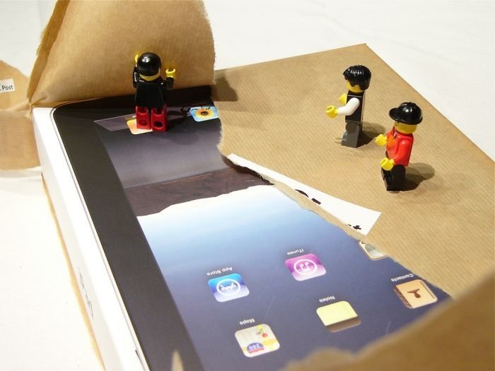 unpacking ipad with lego people