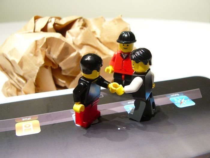 unpacking ipad with lego people