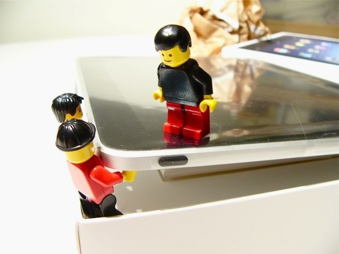 unpacking ipad with lego people