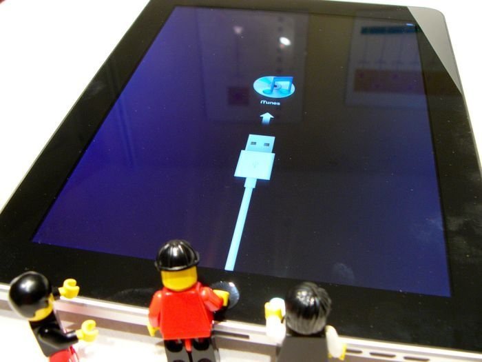 unpacking ipad with lego people