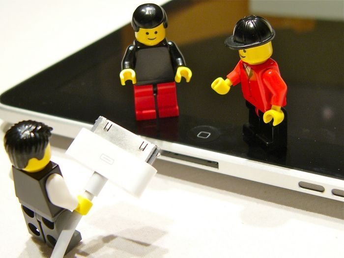 unpacking ipad with lego people